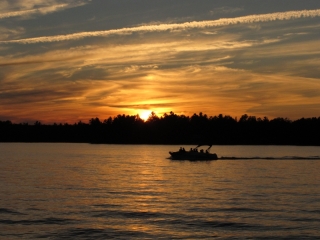 Lake with motorboat at sunset (dig)-Ontario